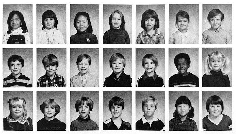 Photograph of a yearbook page from the 1981 to 1982 classbook. A first grade class is shown. The student pictures are black and white head-and-shoulder portraits. They are arranged in three rows and seven columns.